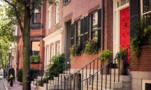 Row of historic brick homes in Boston where narrow property lines may require boundary surveys