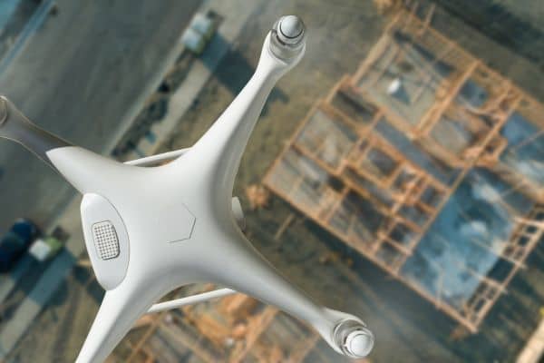 drone surveying over boston construction site - ALTA SURVEY Massachusetts Drone surveying over a Boston construction site capturing aerial mapping and LiDAR data