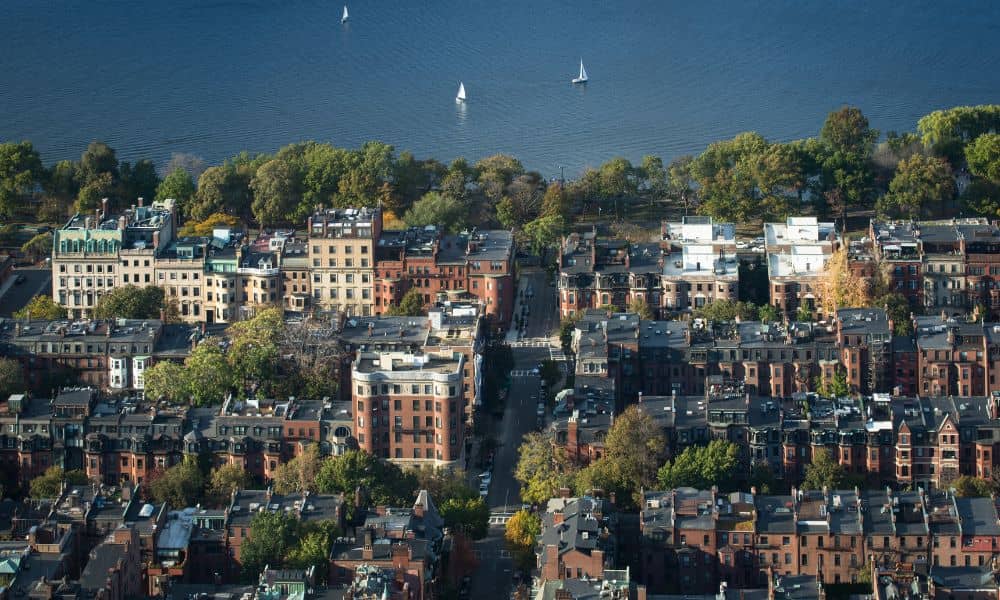 Drone aerial view of historic Boston rowhouses showing narrow streets and rooftops, ideal for drone land surveying applications

