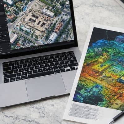 Drone land surveying data showing an orthomosaic map and 3D point cloud used for accurate urban project planning