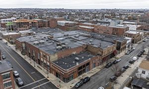 Aerial view of adjoining commercial parcels forming a potential redevelopment site supported by an ALTA title survey